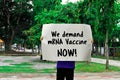 Gray label with text Ã¢â¬ÅWe demand mRNA Vaccine NOW!Ã¢â¬Â